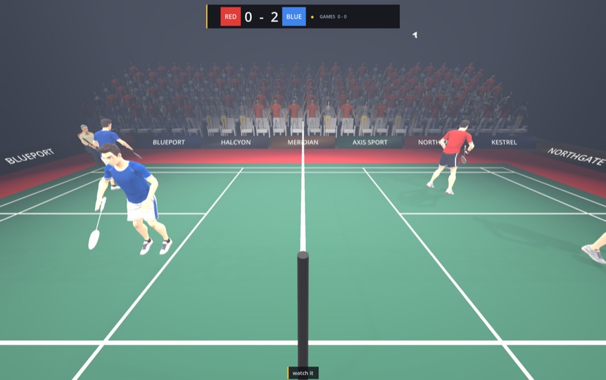 Badminton rally seen from the umpire's chair, scoreboard reading 0-2
